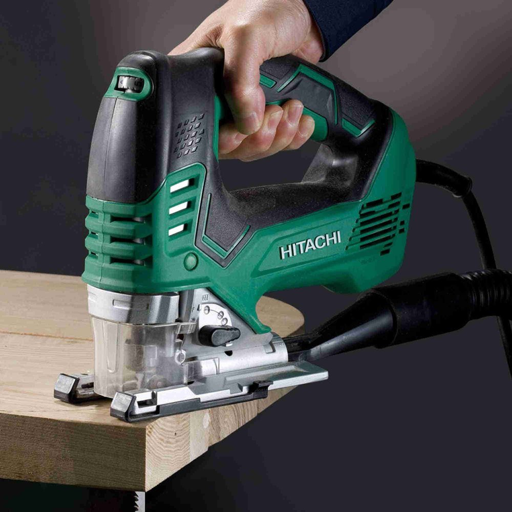 The Hikoki Jigsaw CJ160V mains powered tool is being used to cut around a 50mm board while connected to a vacuum dust extractor.