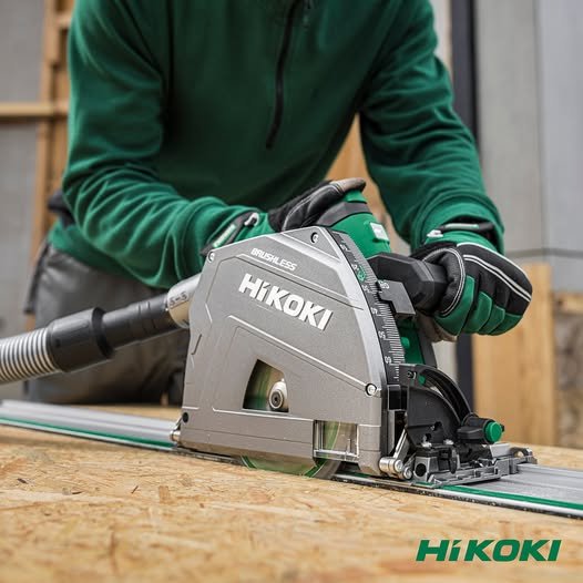 The HiKOKI plunge saw in action as an operator uses the track to cut through a sheet of OSB